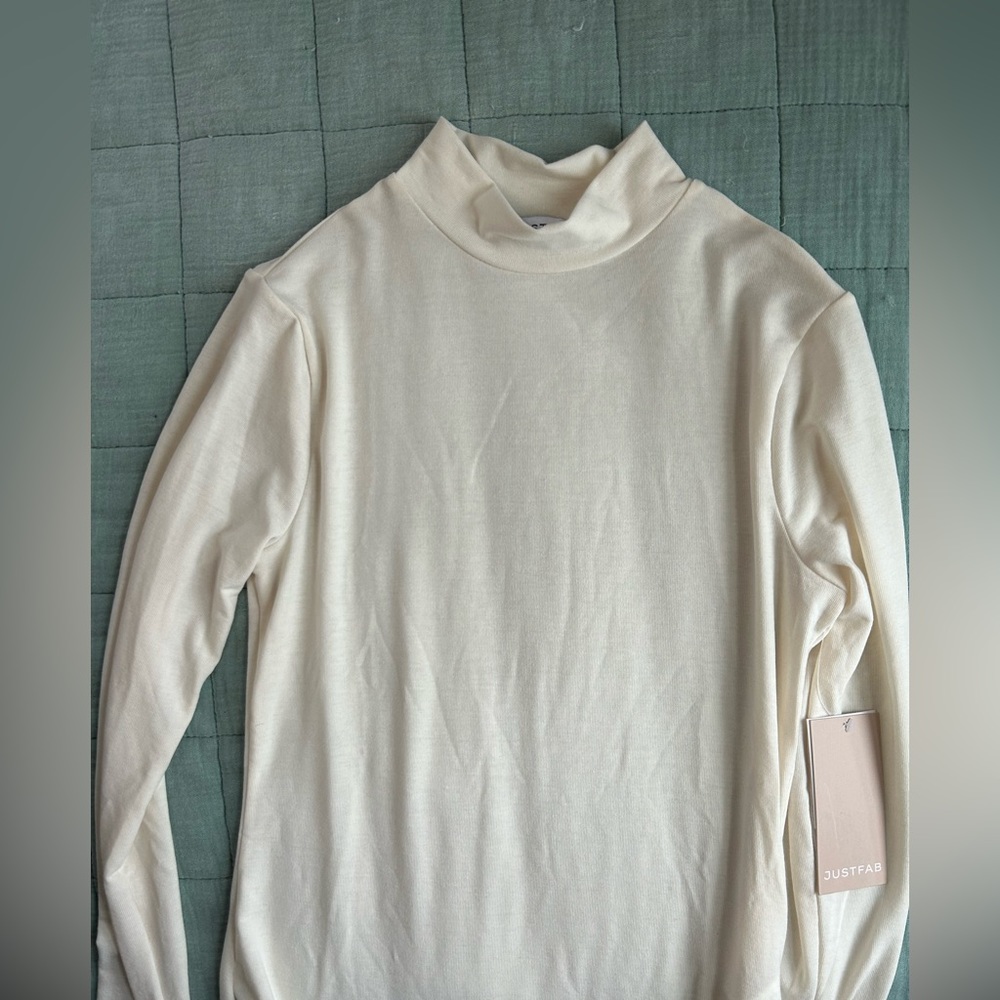 Basic lightweight turtleneck top. Layering, business casual, spring fashion